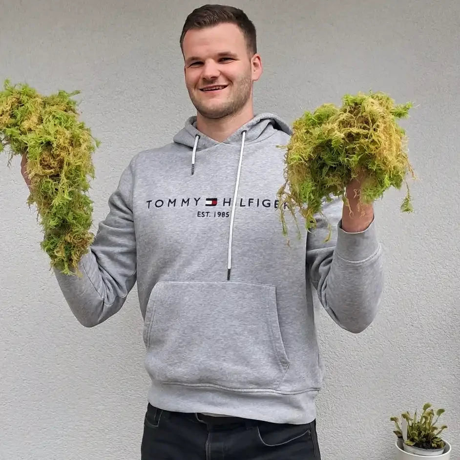 Persoon met levend Sphagnum mos.